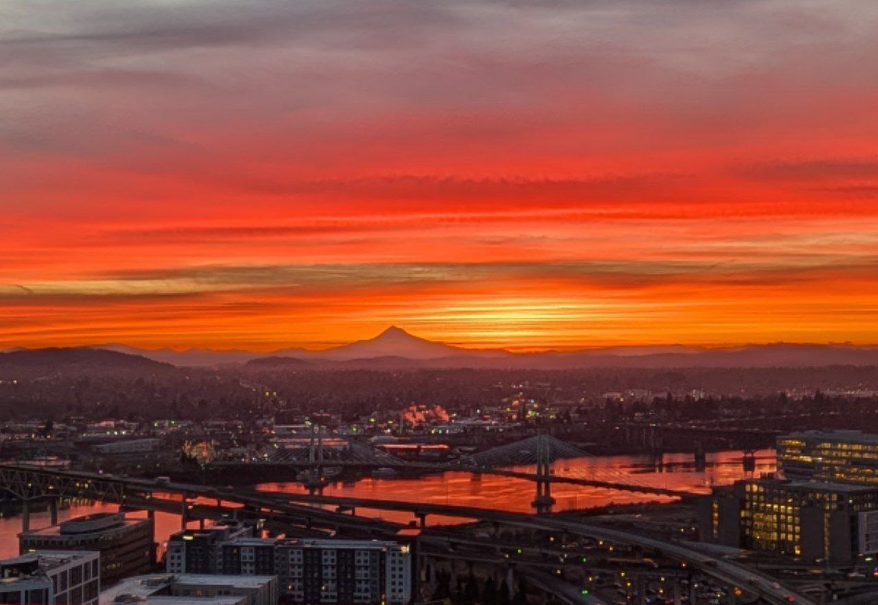 Orange sunrise reflecting on the Willamette River